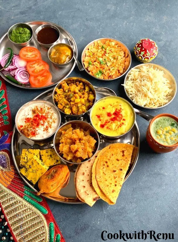 This Rajasthani Thali is a delicious thali made from pantry staple or cupboard ingredients and features Papad ki Kadhi, Mangodi ki sabji, Aam ki Launji etc.