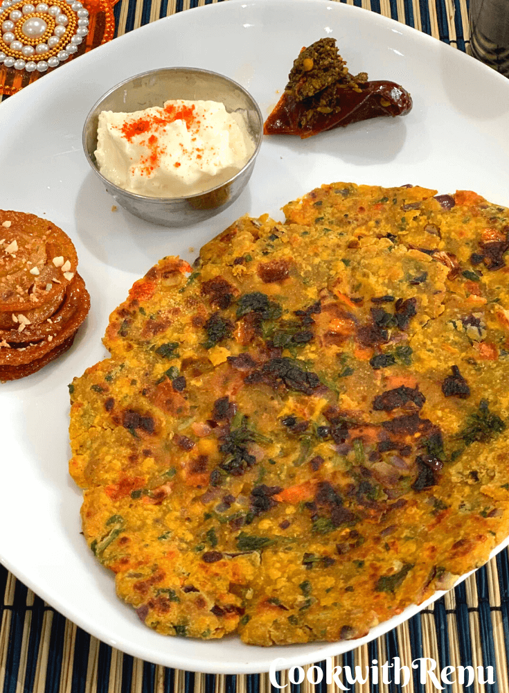 Rajasthani Tikkar paratha served along with Homemade Jalebi, yogurt, pickle