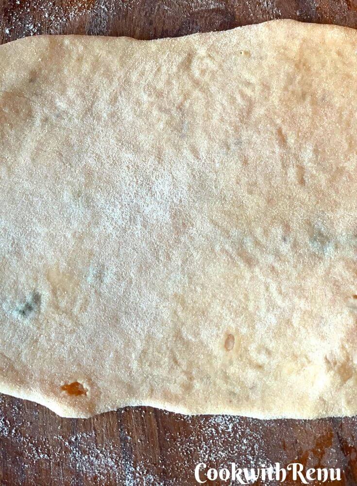 Rolling the partha after the stuffing