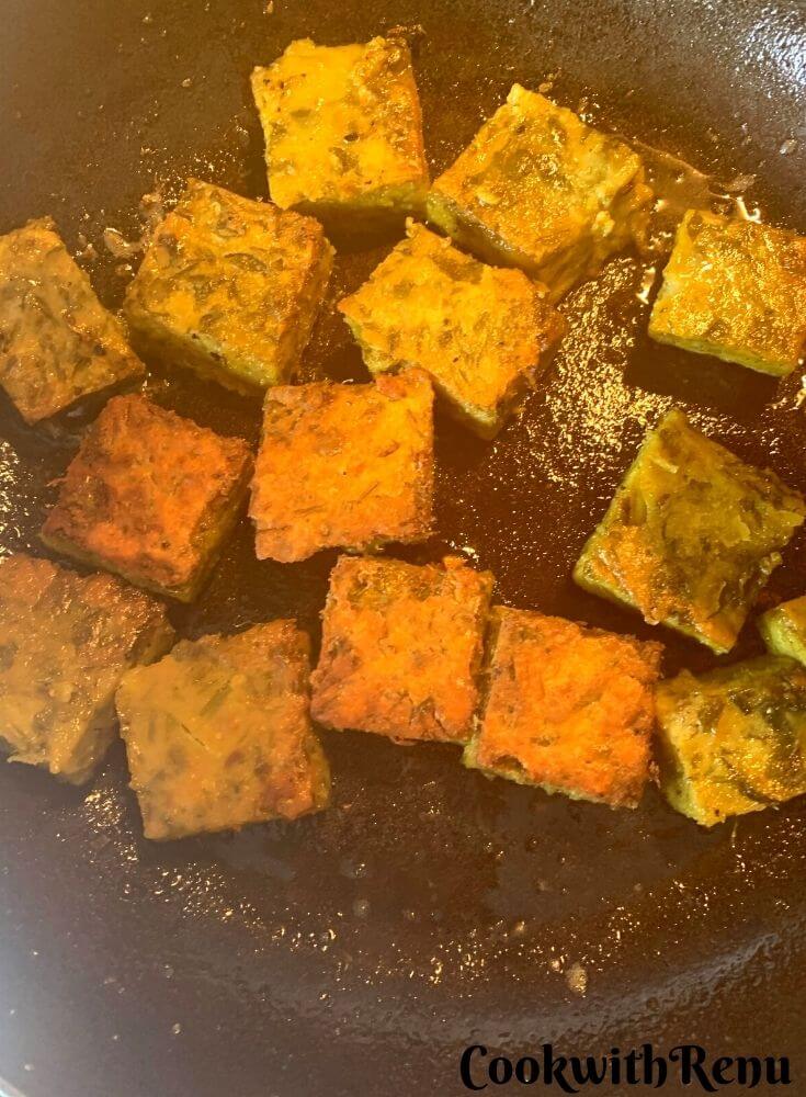 Shallow Frying the Vadi in a cast iron pan