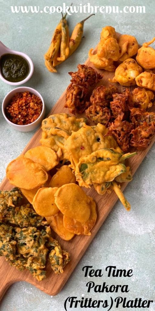 Tea time Pakora Platter is an addictive platter which has 6 different types of pakoras. They are yummy and crunchy snack or tea time fritters. Fritters are served on a wooden board with Coriander, Imli and Garlic chutneys on the side.