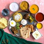 Vegetarian Maharashtrian Thali is a comforting and soul-satisfying, balanced meal bursting with spicy and sweet flavours from various dishes.