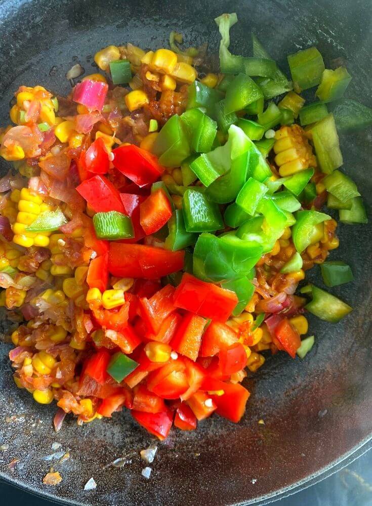 Adding green peppers in the mixture