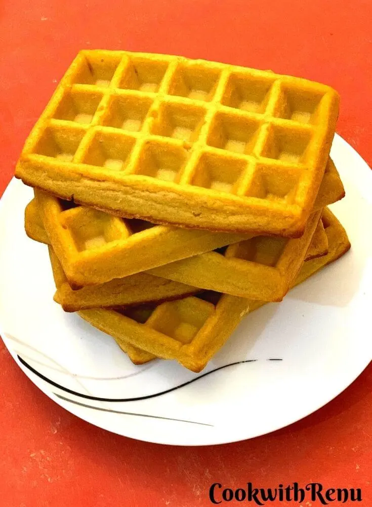 Close up look of oven baked Pumpkin Waffles, stacked one above the other