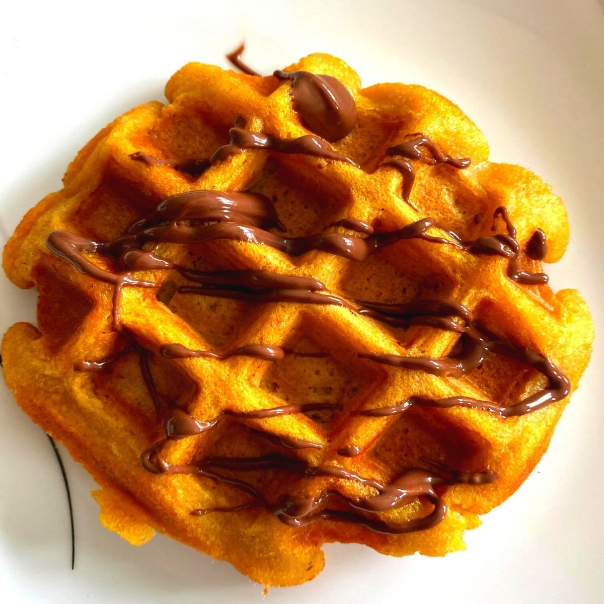 Whole Wheat Pumpkin Waffles are an easy fuss-free recipe, with the goodness of pumpkin, are crunchy on the outside and soft inside.