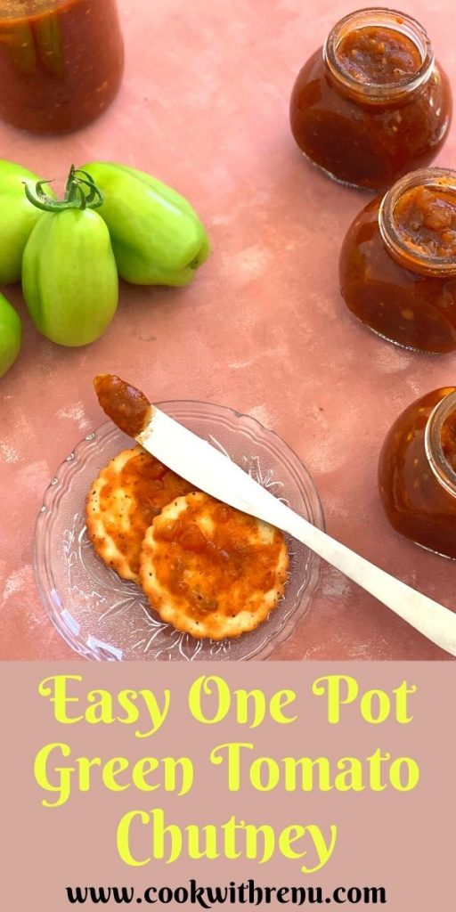 Easy green tomato chutney is a delicious and lip-smacking chutney made using fresh green tomatoes bursting with Sweet, and Spicy flavors. The chutney is smeared on a cracker and seen in the background is 3 small bottles filled and one big, with some fresh green tomatoes.