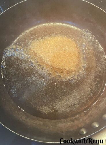 Adding Sugar and Water in Pan