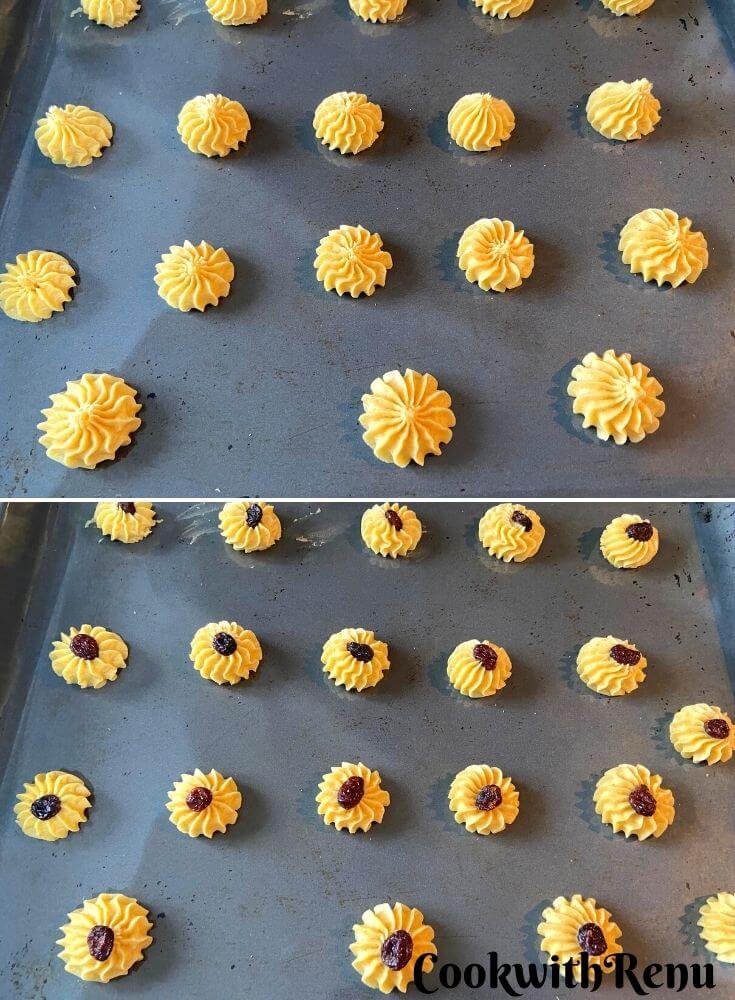 Cookies piped on a baking tray