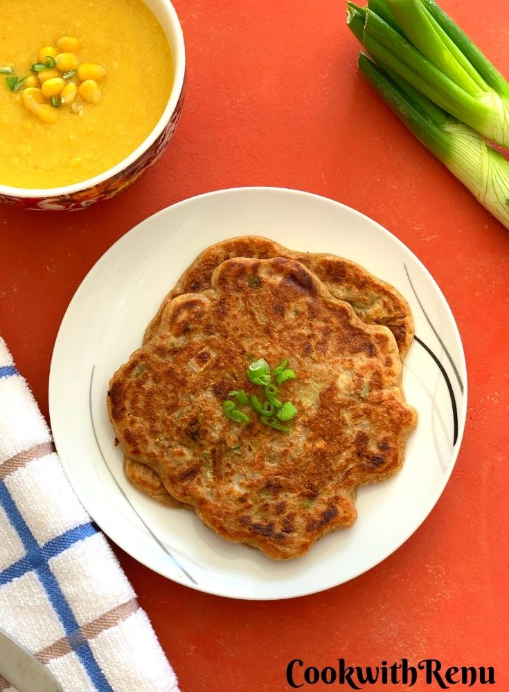 Sourdough Discard Scallion Pancakes served on a white plate, with Sweet Corn soup seen on the side along with some green scallion