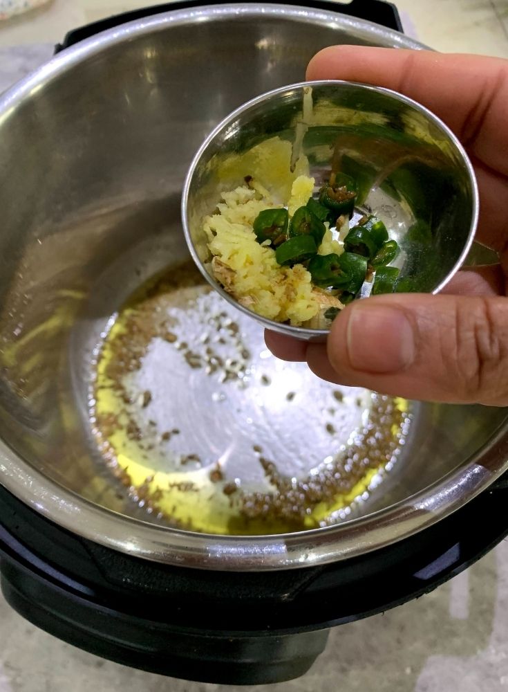 Adding of Ginger and Green Chillies