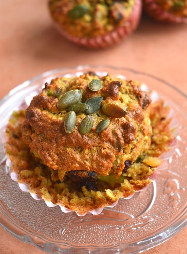 Close up look of breakfast muffins on a plate with nice texture and sunflower seeds topped on it