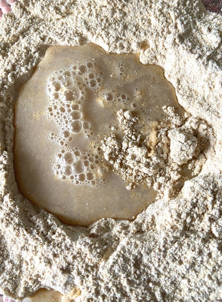 Mixing of the yeast mixture in the dough