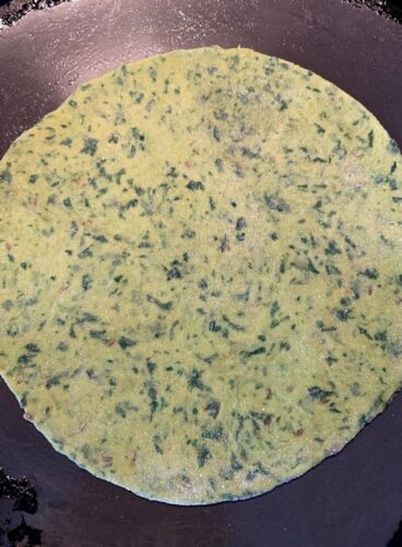 Paratha ready to be cooked on a tava