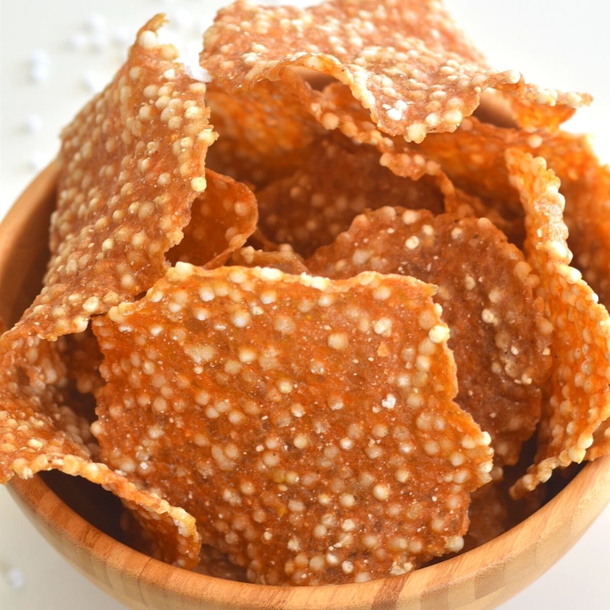 A brown bowl filled with farali aloo sabudana papad