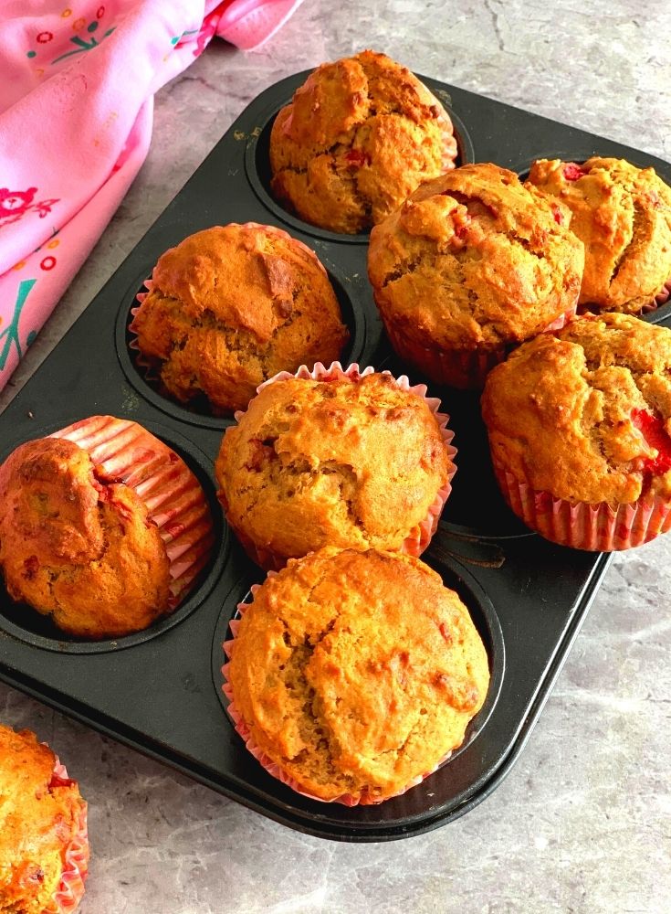Eggless Strawberry Muffins seen on a muffin tray