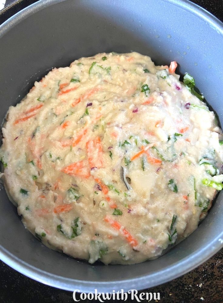 Savoury Luni Poda Pitha Batter poured in a pan