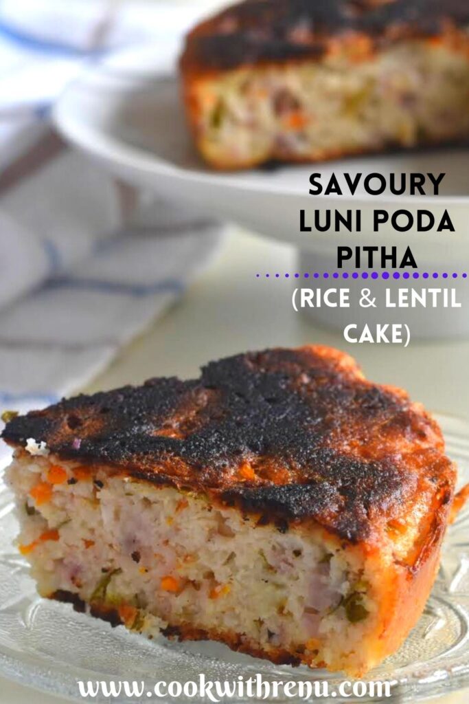 A slice of Savoury Luni Poda Pitha served on a plate. The soft and porus texture of the inside is clearly seen with crispy top and edges