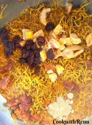 Adding of dates, raisins, jaggery and dry mango powder