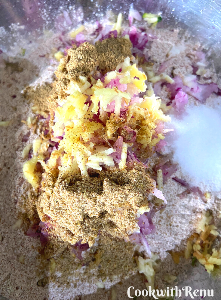 Adding onion and zucchini in flour