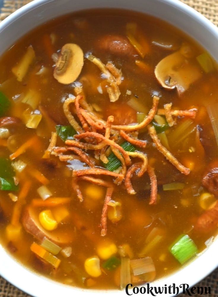 Close up look of Vegan Corn and Mushroom Soup served in a white bowl.