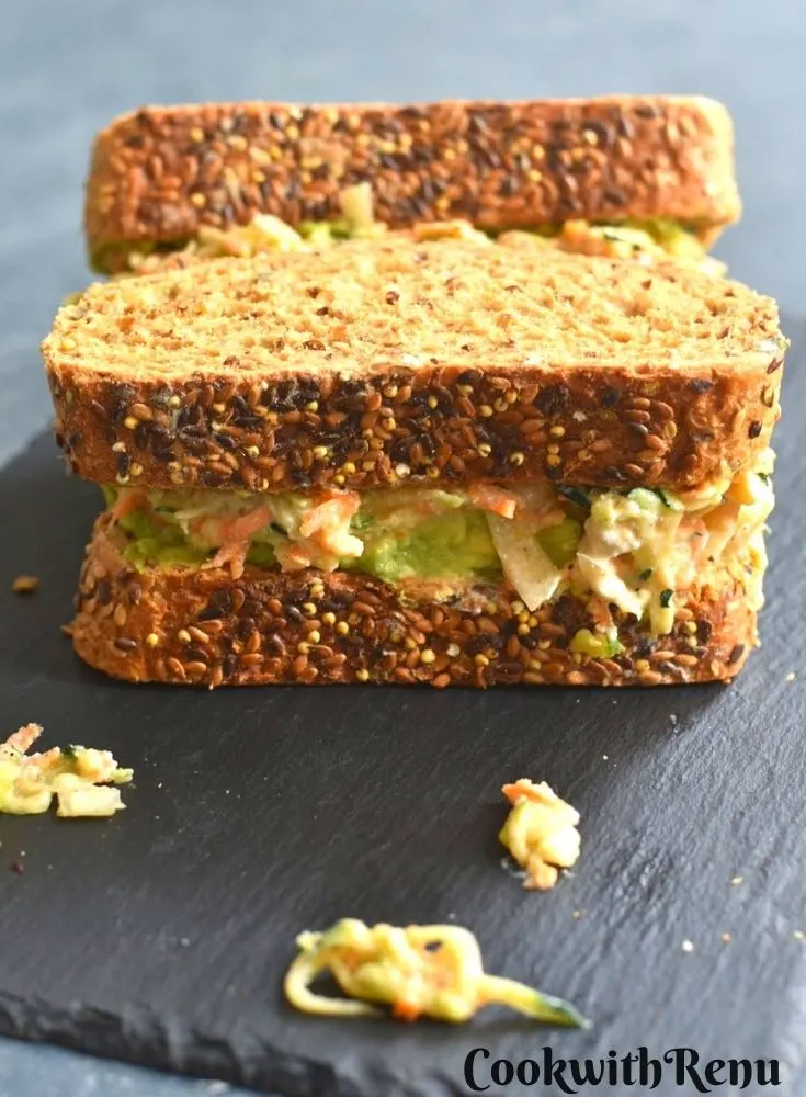 Zucchini, Carrot Sandwich served on a black cheese board