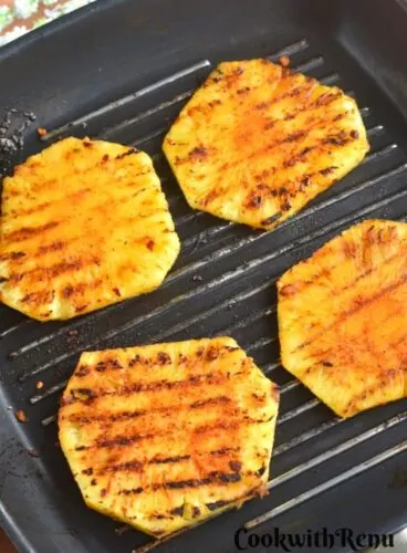 Peri Peri Grilled Pineapple on a grilled pan