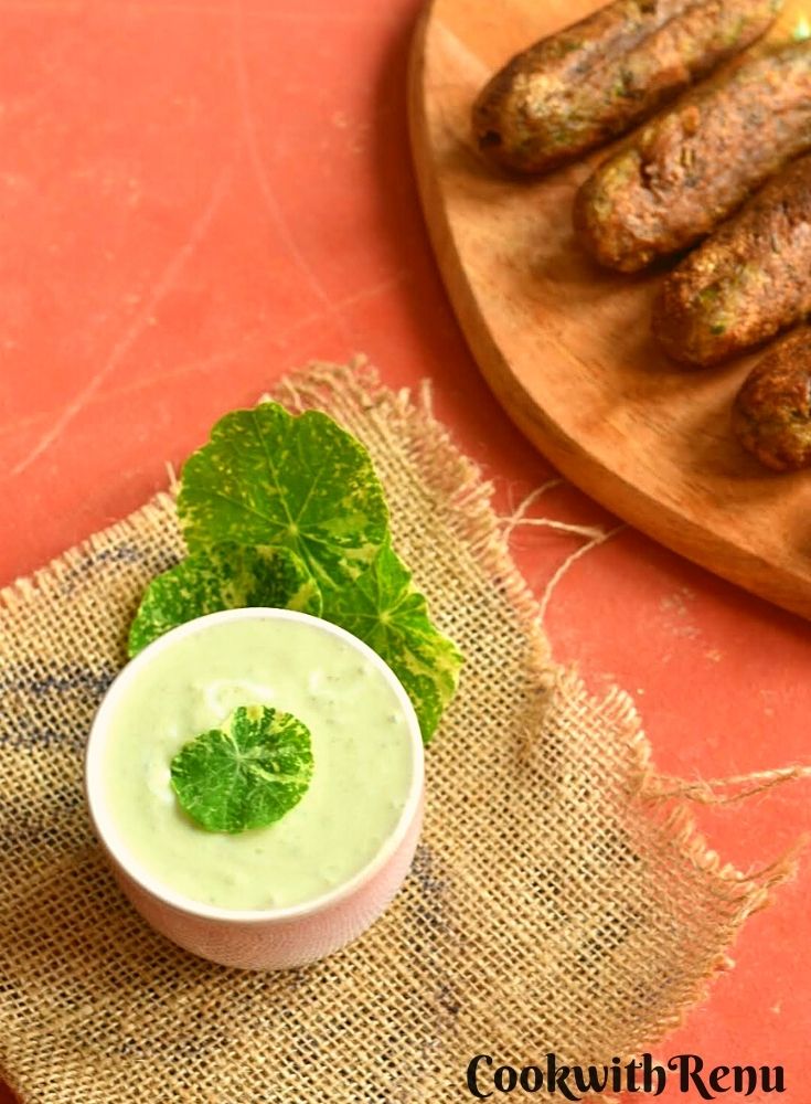 Nasturtium Leaves & Stems Raita served in a small bowl along with some farali kebabs