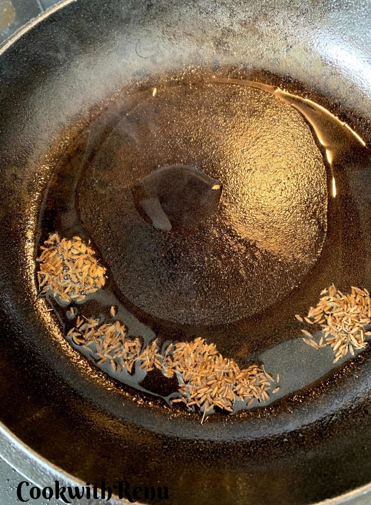 Adding Cumin in Jeera