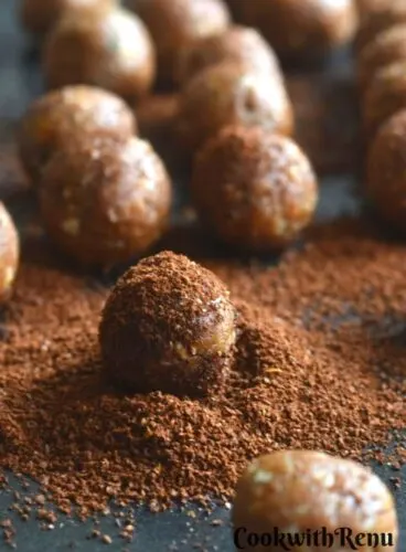 A close up look of one of the energy bites, dusted with coffee powder