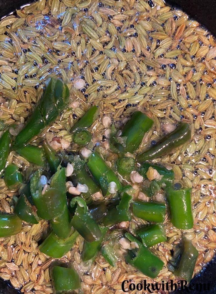 Addition of green chilies and fennel seeds