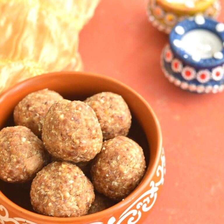 Oats Energy Bites in a brown bowl. seen in background are some diyas