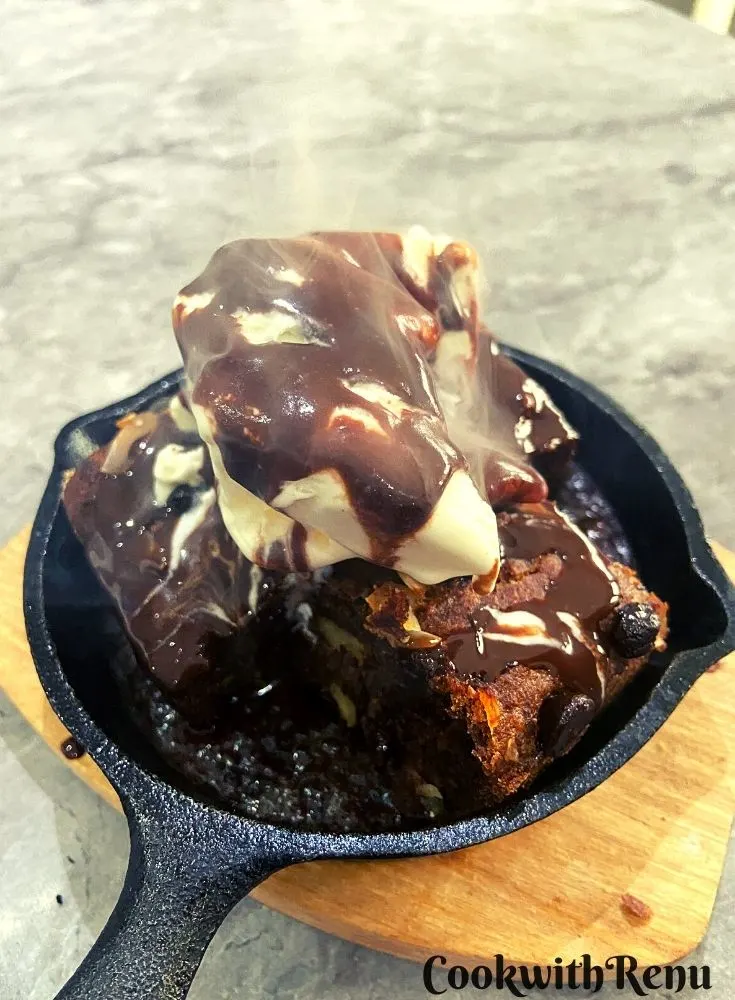 Ragi Sizzling Brownie served on a black cast iron pan