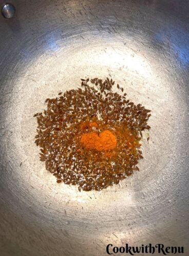 The tempering of cumin seeds, and turmeric