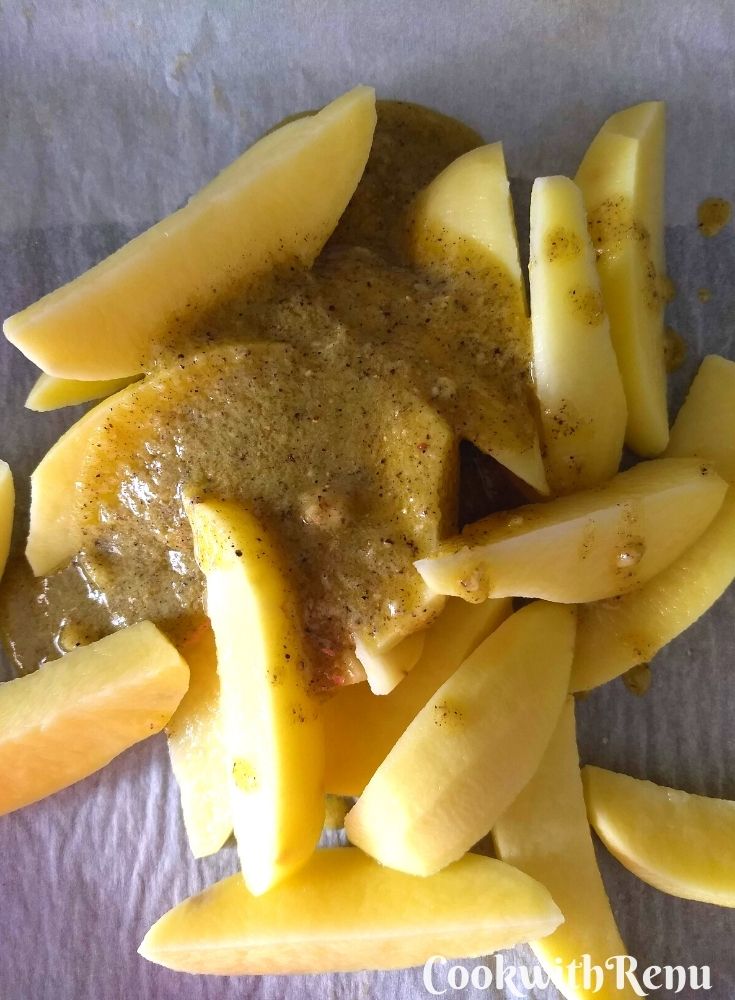 Adding of garlic, olive oil, oregano, semolina in potatoes