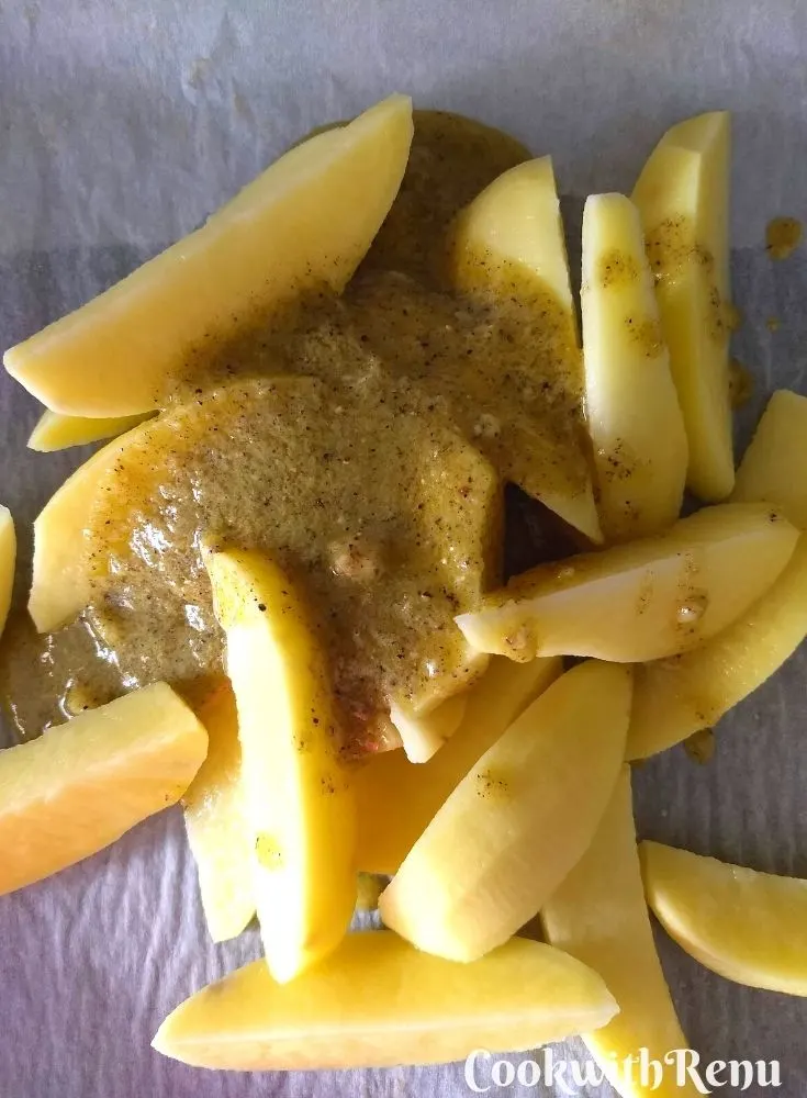 Adding of garlic, olive oil, oregano, semolina in potatoes