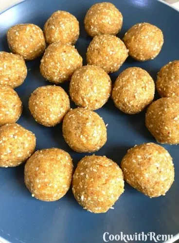 Sesame Milk Solids Ladoo Ready and arranged on a blue plate
