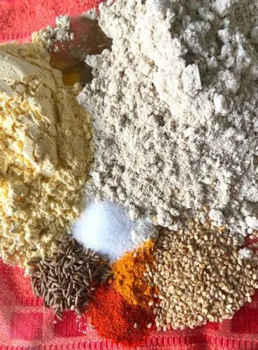 Flours, Spices & Oil added to a bowl