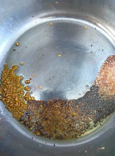 Tempering of cumin, mustard and fenugreek seeds and asafetida