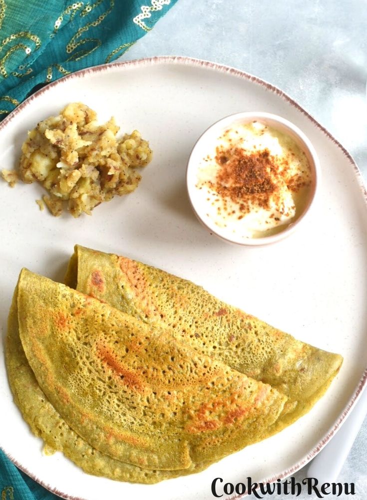 Farali Buchkwheat Pancake and Kali Mirchi Aloo Sabji along with yogurt served in a plate