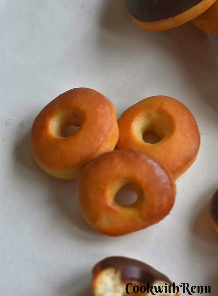 Sugar glazed donuts on a parchment paper
