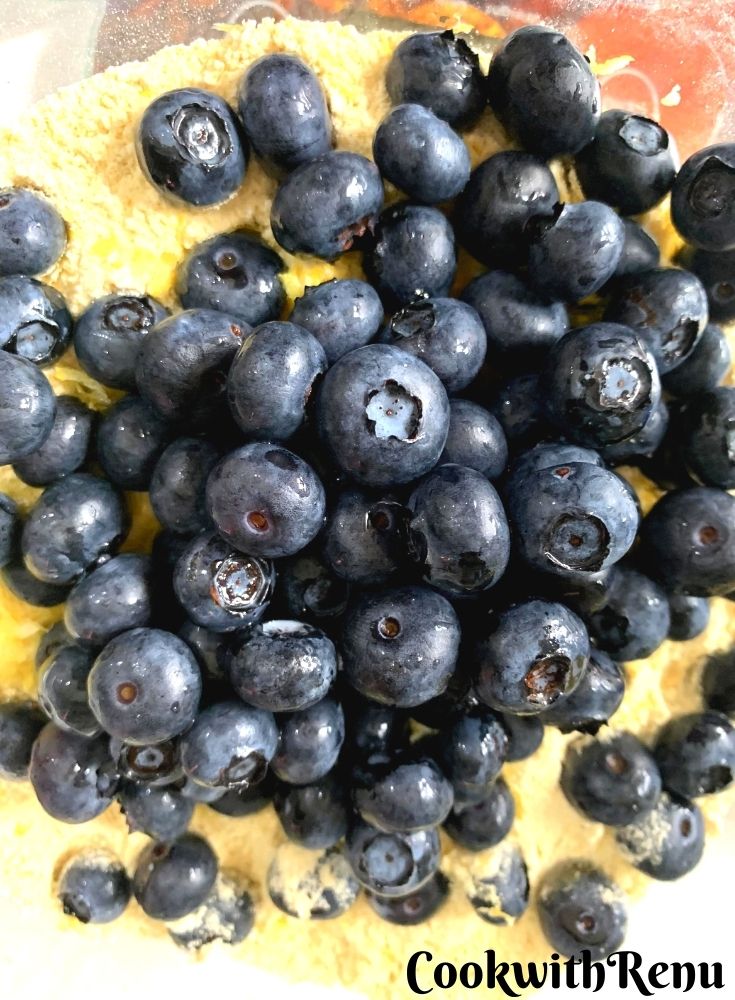 Adding of blueberries in flour