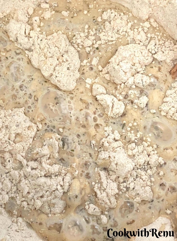 Adding of milk and yeast mixture into the dough