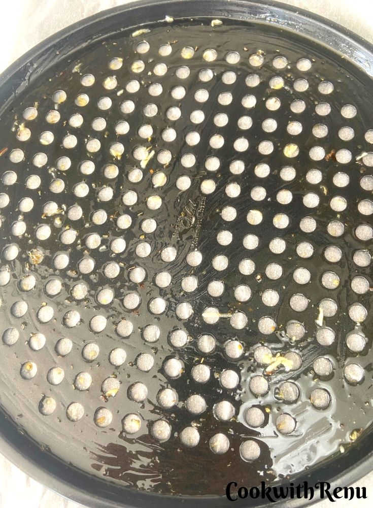Applying butter on a baking tray