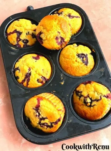Whole Wheat Blueberry Cornmeal Lemon Muffins in a muffin tray