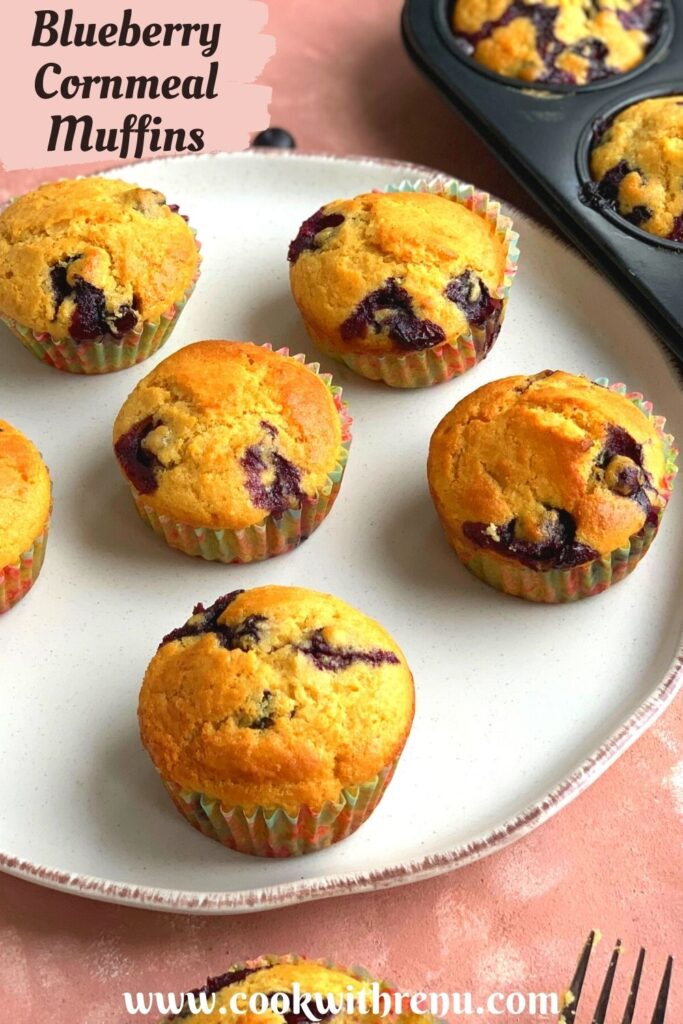Blueberry Cornmeal Muffins arranged on a white plate