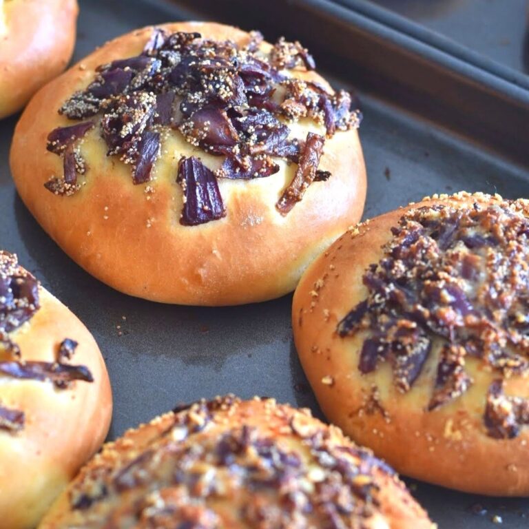 Close up look of Cebularz Lubelski arranged on a baking tray