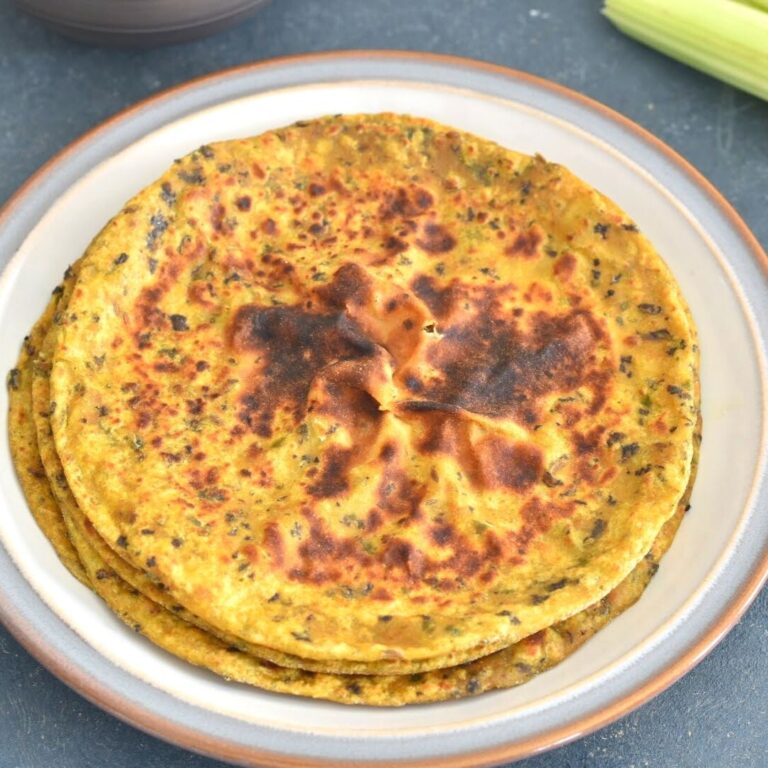 Stack of Celery and Kale Paratha served on a white plate
