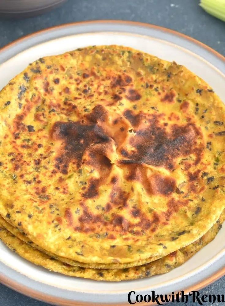 Stack of Celery and Kale Paratha served on a white plate