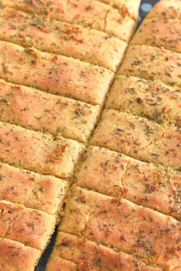 Dominos Style Cheese Garlic Breadsticks on a baking tray