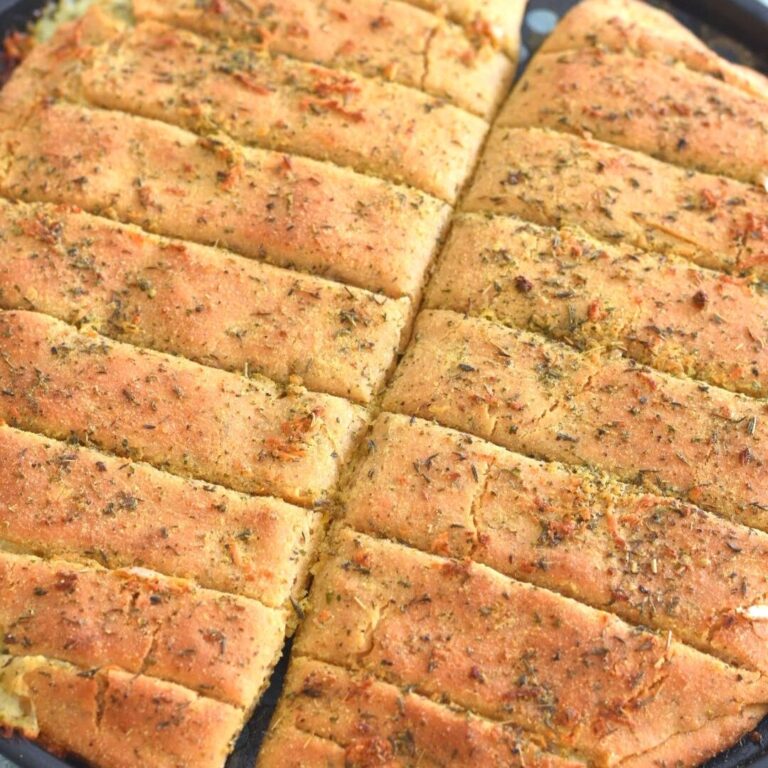 Dominos Style Cheese Garlic Breadsticks on a baking tray